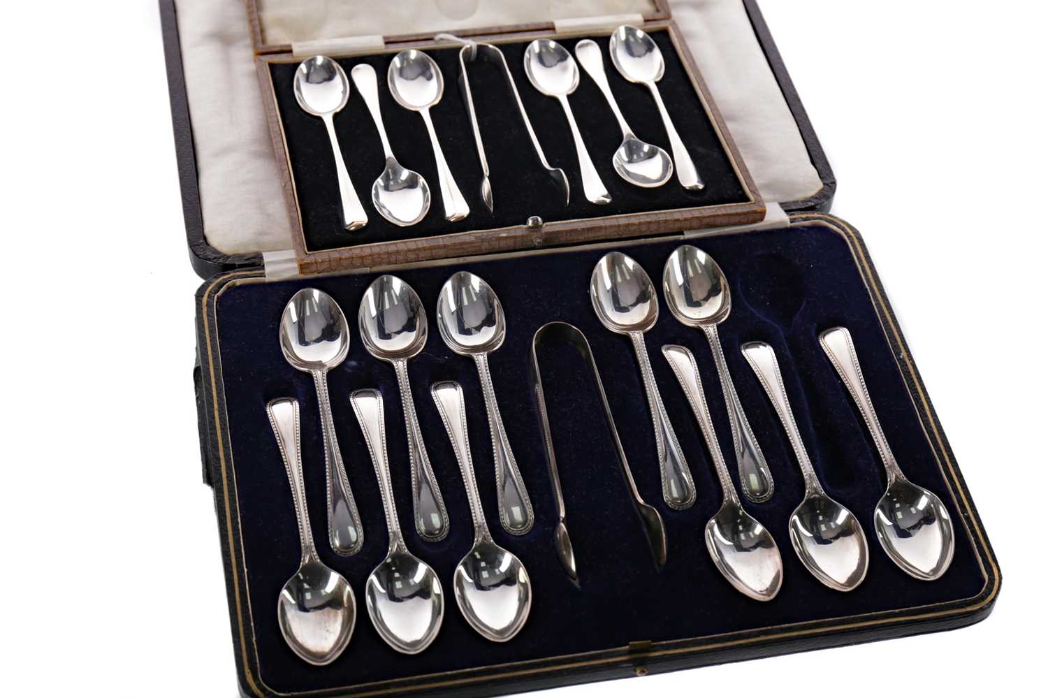Lot 448 - A SET OF SILVER SPOONS AND TONGS AND A PART SET