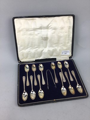 Lot 115 - A SET OF TWELVE SILVER TEASPOONS AND SUGAR TONGS IN A FITTED CASE