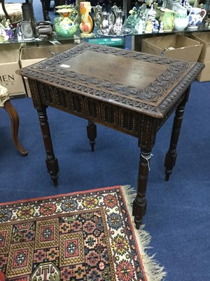 Lot 404 - A CARVED MAHOGANY OCCASIONAL TABLE AND A TWO TIER TROLLEY
