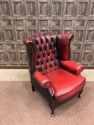 Lot 1319 - AN OXBLOOD LEATHER WINGBACK ARMCHAIR