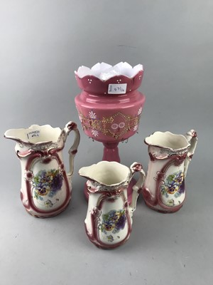 Lot 471 - A SET OF THREE GRADUATED HAND PAINTED JUGS AND A PINK GLASS LUSTRE