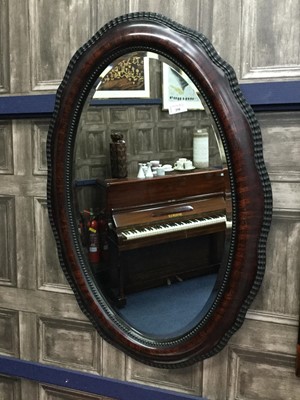 Lot 250 - A STAINED WOOD WALL MIRROR