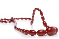 Lot 146 - CHERRY BAKELITE NECKLACE formed by graduated...