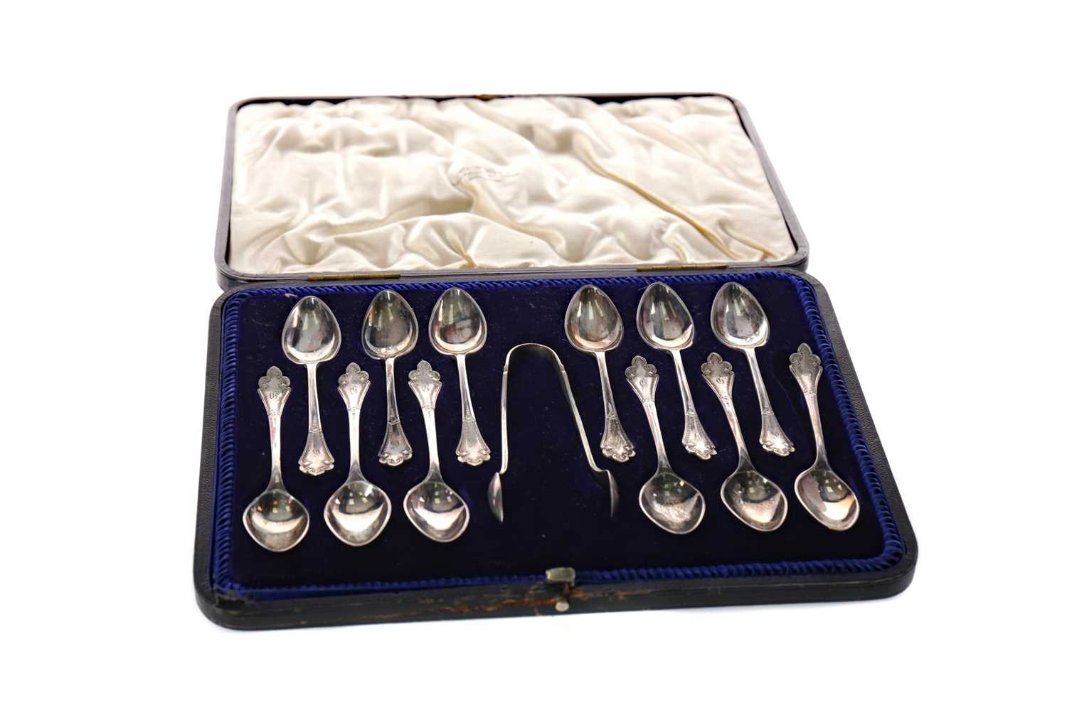 Lot 483 - A CASED SET OF TWELVE SILVER TEASPOONS AND TONGS
