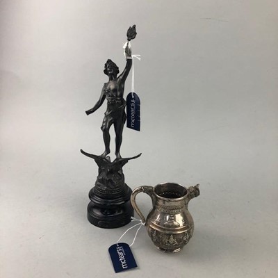 Lot 258 - AN INDIAN WHITE METAL MILK JUG AND A SPELTER FIGURE