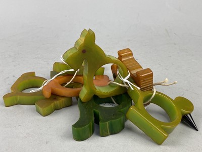 Lot 526 - EIGHT ART DECO BAKELITE NOVELTY NAPKIN RINGS