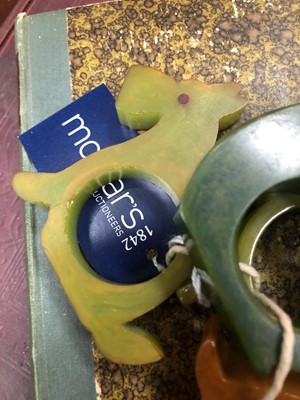 Lot 526 - EIGHT ART DECO BAKELITE NOVELTY NAPKIN RINGS