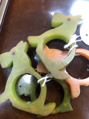 Lot 526 - EIGHT ART DECO BAKELITE NOVELTY NAPKIN RINGS