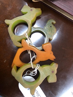 Lot 526 - EIGHT ART DECO BAKELITE NOVELTY NAPKIN RINGS