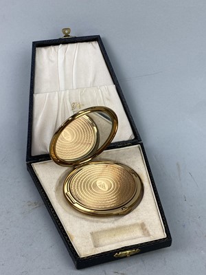 Lot 528 - A KIGU GILTMETAL COMPACT