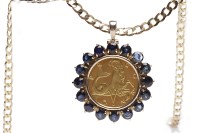 Lot 165 - GEM SET ZODIAC PENDANT ON CHAIN the coin style...