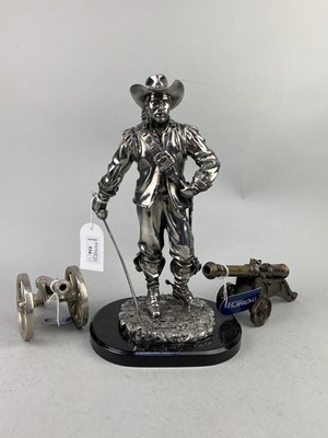 Lot 534 - A SILVERED RESIN FIGURE OF A CAVALIER AND TWO CANNONS