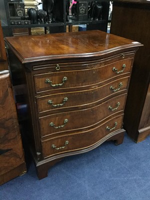 Lot 561 - A WALNUT REPRODUCTION CHEST OF DRAWERS