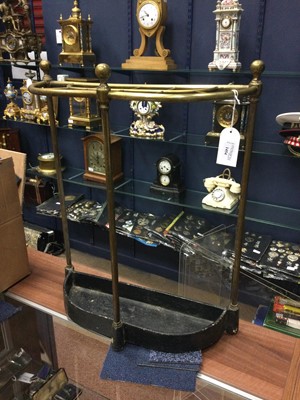 Lot 1454 - A BRASS BOW SHAPED TEN DIVISION STICK STAND