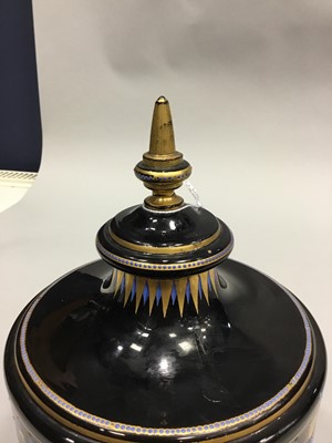 Lot 1036 - A CONTINENTAL EGYPTIAN REVIVAL GLASS URN AND COVER