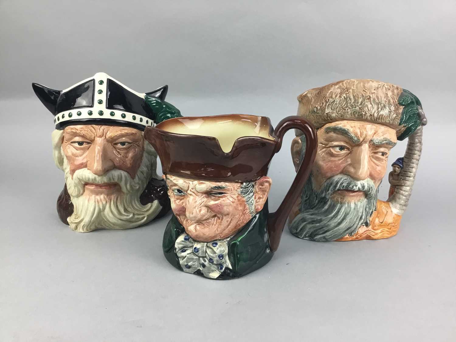 Lot 62 - A LOT OF THREE ROYAL DOULTON CHARACTER JUGS