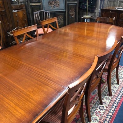 Lot 570 - A MAHOGANY DINING SUITE