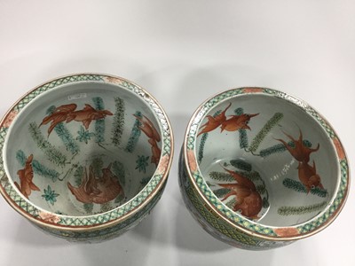 Lot 710 - A MATCHED PAIR OF EARLY 20TH CENTURY CHINESE FAMILLE VERTE FISH BOWLS/PLANTERS