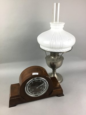 Lot 153 - A 1930S WALNUT MANTEL CLOCK ALONG WITH AN OIL LAMP