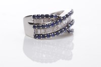 Lot 199 - SAPPHIRE AND DIAMOND RING of crossover form,...