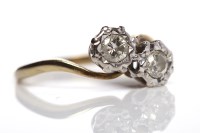 Lot 209 - DIAMOND TWO STONE RING set with two brilliant...