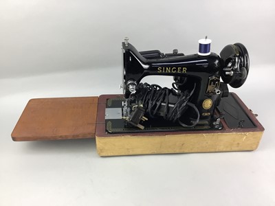 Lot 54 - A CASED SINGER SEWING MACHINE