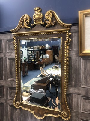 Lot 274 - A WALNUT WALL MIRROR