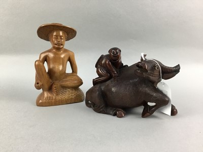 Lot 317 - A CHINESE CARVED FIGURE OF A WATER BUFFALO ALONG WITH A FIGURE