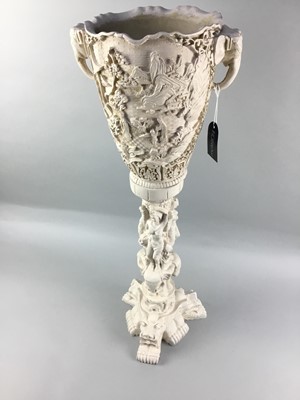 Lot 318 - AN IVORINE JARDINIERE AND STAND