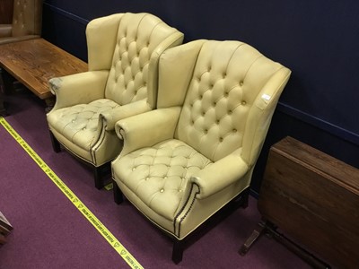 Lot 412 - A PAIR OF CREAM LEATHER WING BACK ARMCHAIRS