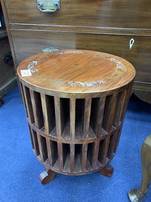 Lot 370 - AN INDIAN HARDWOOD REVOLVING SHELF UNIT AND RECORD CABINET