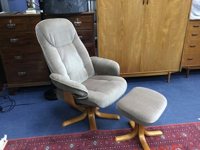 Lot 369 - A MODERN UPHOLSTERED SWIVEL ARM CHAIR AND MATCHING FOOTSTOOL