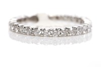 Lot 263 - DIAMOND ETERNITY RING set with round diamonds...