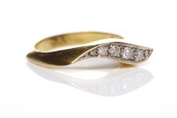 Lot 275 - UNUSUAL DIAMOND SET RING the curved bezel with...