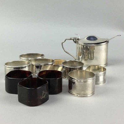 Lot 600 - A SILVER MUSTARD POT AND SILVER AND OTHER NAPKIN RINGS