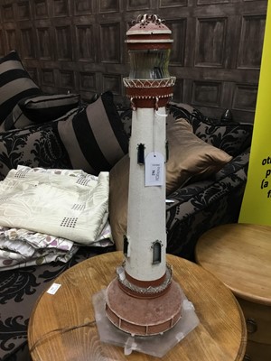 Lot 562 - A NOVELTY TABLE LAMP IN THE FORM OF A LIGHTHOUSE