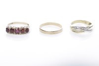 Lot 298 - THREE GOLD DRESS RINGS comprising a fourteen...