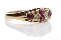 Lot 303 - VICTORIAN RUBY AND DIAMOND RING set with round...