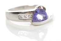 Lot 308 - TANZANITE AND DIAMOND DRESS RING with a...