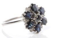 Lot 350 - SAPPHIRE AND DIAMOND CLUSTER RING formed by...