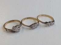 Lot 356 - THREE DIAMOND RINGS each set in eighteen carat...