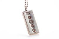 Lot 365 - STERLING SILVER INGOT PENDANT on a silver...