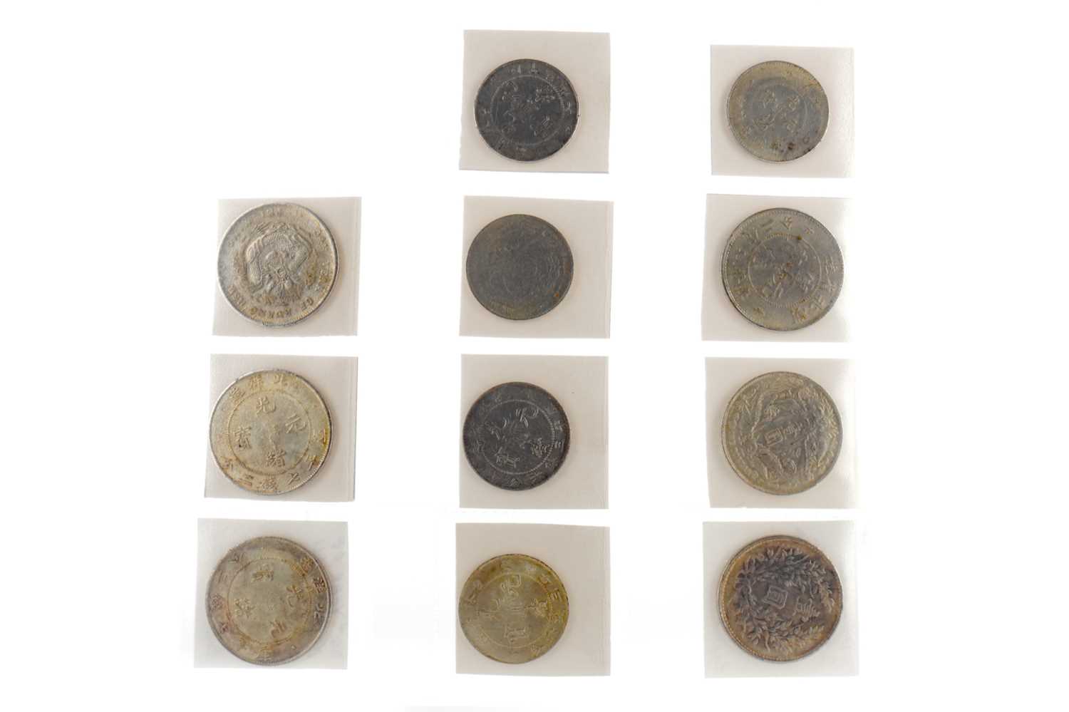 Lot 83 - A COLLECTION OF SILVER CHINESE DOLLARS AND HALF DOLLARS
