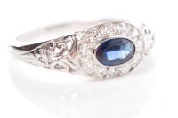 Lot 391 - WHITE GOLD SAPPHIRE AND DIAMOND RING the oval...