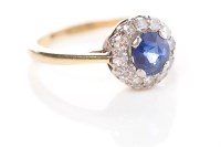 Lot 399 - SAPPHIRE AND DIAMOND CLUSTER RING the central...