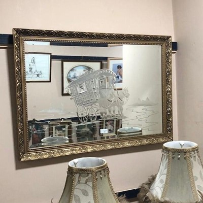 Lot 104 - A BEVELLED WALL MIRROR