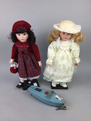 Lot 270 - A CLOCKWORK TIN PLATE MODEL BOAT AND VINTAGE DOLLS