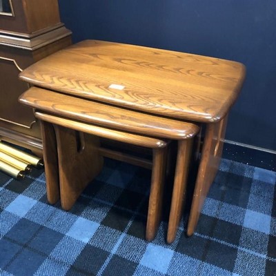 Lot 191 - A NEST OF THREE ERCOL OAK OCCASIONAL TABLES