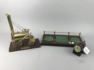 Lot 28 - A BRASS MODEL OF STEPHENSON'S ROCKET, DECANTER STAND AND A THERMOMETER