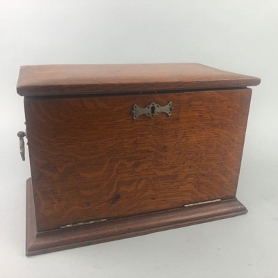 Lot 379 - AN EARLY 20TH CENTURY OAK STATIONARY BOX